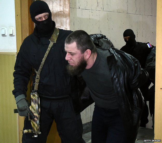 Tamerlan Eskerkhanov being led into court